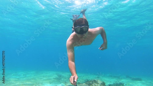 Swim in the blue ocean with action cam photo