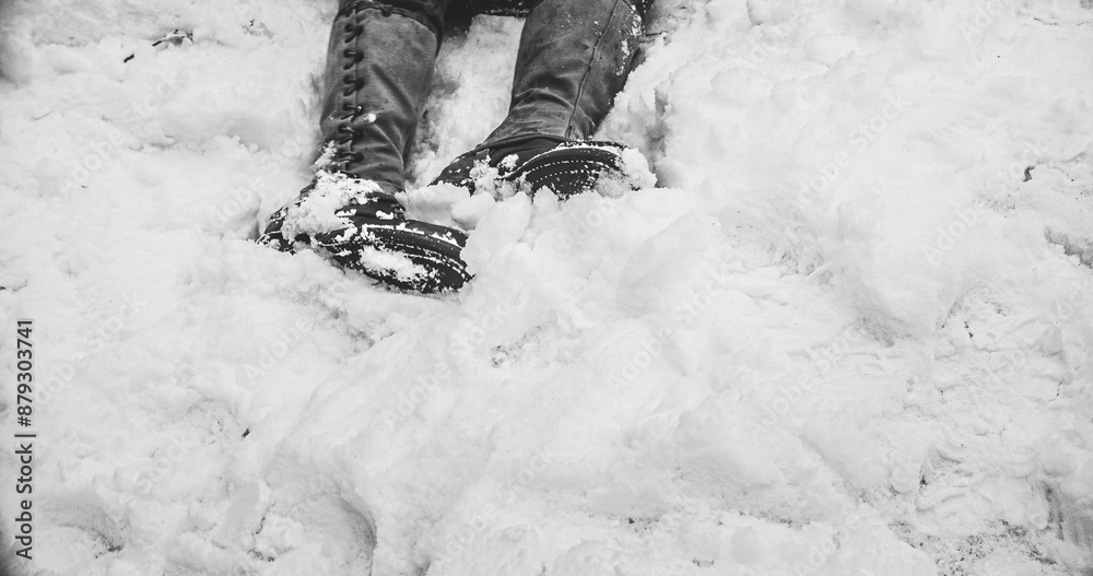 Fallen Soldier Of United States Army Infantry At World War Ii. Close-up View On Army Boots Of Re-enactor Dressed As American Infantry Soldier. Heroes Of War. Military Boots Of Dead Soldier On Snow