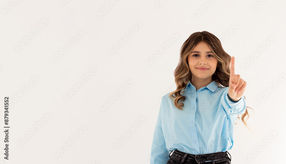 Portrait of young woman making stop sign with finger in front of the camera. Portrait of young woman making stop sign with finger in front of the camera.