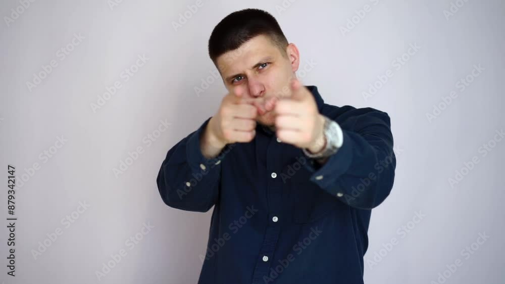 a man in a good mood.
We point with a gesture at someone and turn to you.
A man points his fingers at someone.
Point, point, direct a man in a good mood.
We point with a gesture at someone and turn to you.
A man points his fingers at someone.
Point, point, direct