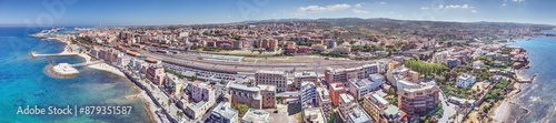 Drone panorama over the Italian city of Civitavecchia with harbor and cruise ships during the day