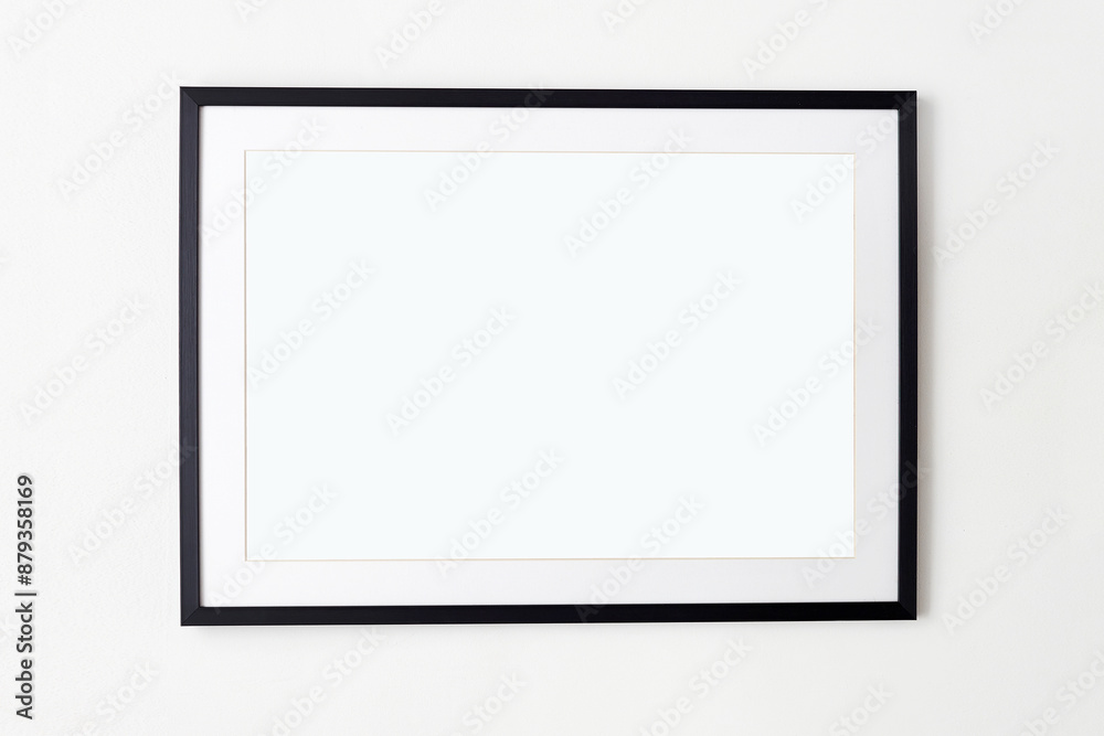 big black picture frame on white wall. Stylish photoframe with passe-partout big black picture frame on white wall. Stylish photoframe with passe-partout