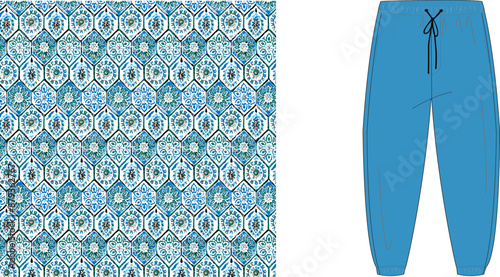 A blue patterned textile and a pair of blue pants with a drawstring on a white background space view