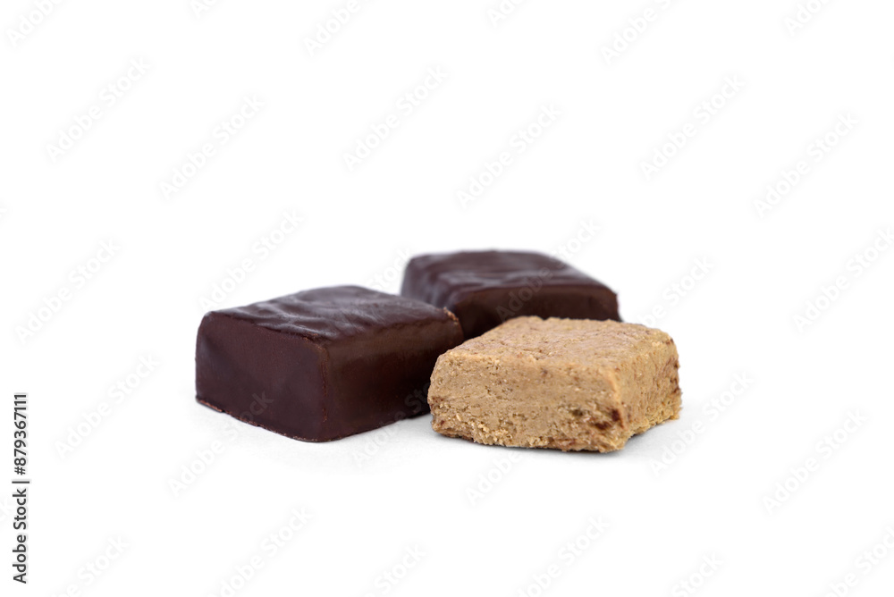 Halva sweets in chocolate isolated on white background. Halva sweets in chocolate isolated on white background.