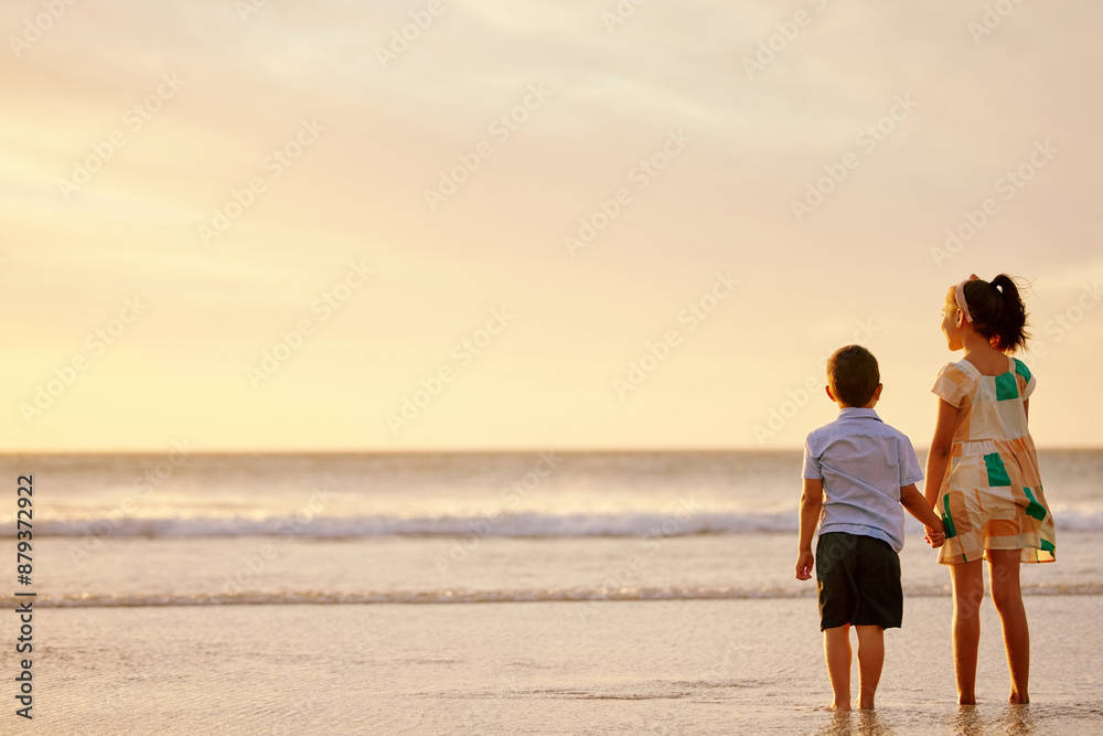 Beach, siblings and kids holding hands at sunset on holiday, vacation and travel together outdoor. Children, back view and brother with sister at sea on mockup space for love on adventure in summer Beach, siblings and kids holding hands at sunset on holiday, vacation and travel together outdoor. Children, back view and brother with sister at sea on mockup space for love on adventure in summer