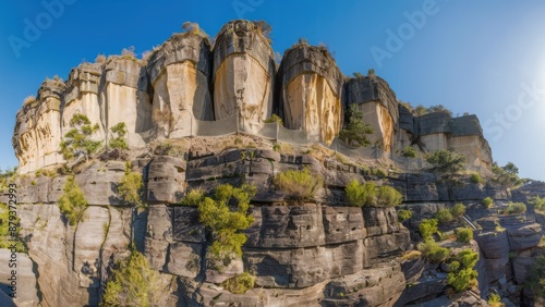 A large rock formation with a road on it near the water, AI