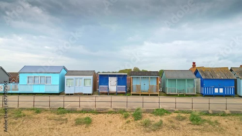 Mablethorpe's coastal beauty captured from the air, showcasing beach huts, sandy shores, and bustling amusement parks. photo