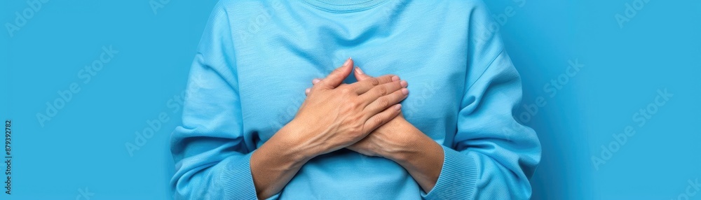 Fototapeta premium Person clutching their chest in pain due to acid reflux, realistic and detailed, medical concept