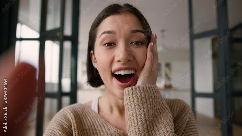 Point of view POV webcam happy Hispanic woman female buyer user influencer excited shocked amazed girl hands typing texting on mobile phone touch screen chatting online message shock winning good news