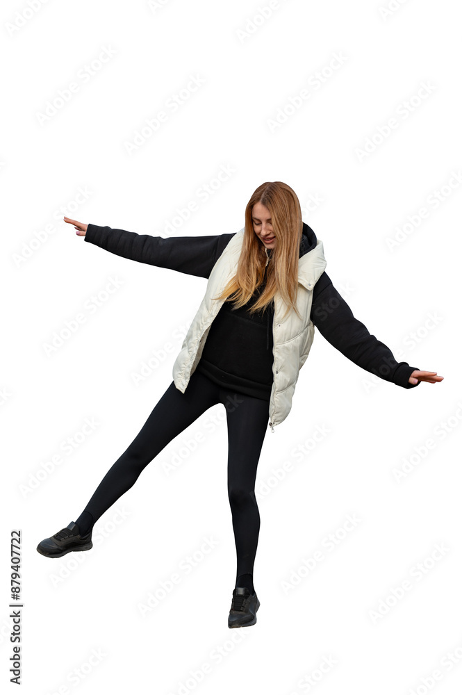 A young attractive woman balances on one leg isolated A young attractive woman balances on one leg isolated