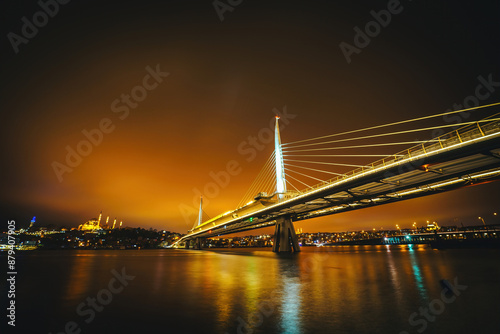 Golden Horn Metro Bridge. Photograph of the modern metro bridge taken at sunset over the estuary in Istanbul, Turkey. photo