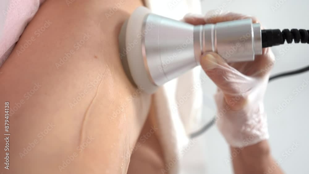 Cryolipolysis fat treatment procedure in the modern cosmetology clinic. Non surgical liposuction to young woman leg. Beauty concept. Vertical shot Cryolipolysis fat treatment procedure in the modern cosmetology clinic. Non surgical liposuction to young woman leg. Beauty concept. Vertical shot