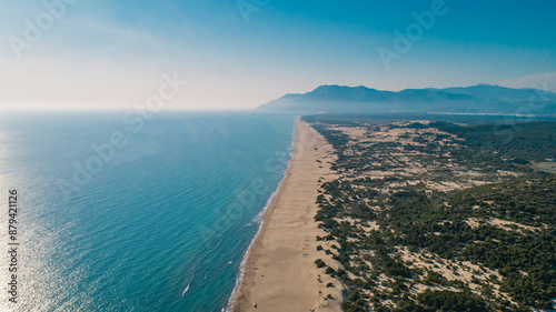 Fototapeta Naklejka Na Ścianę i Meble -  Aerial photo of Patara beach taken with a drone. The beach, surrounded by sand, green trees and mountains, is very famous. Kas, Turkey.