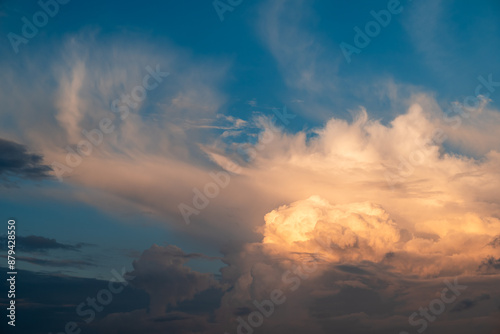 White clouds under sunshine on the sky after the rain. Concept of changeable weather, beauty of the sky, greatness of nature photo