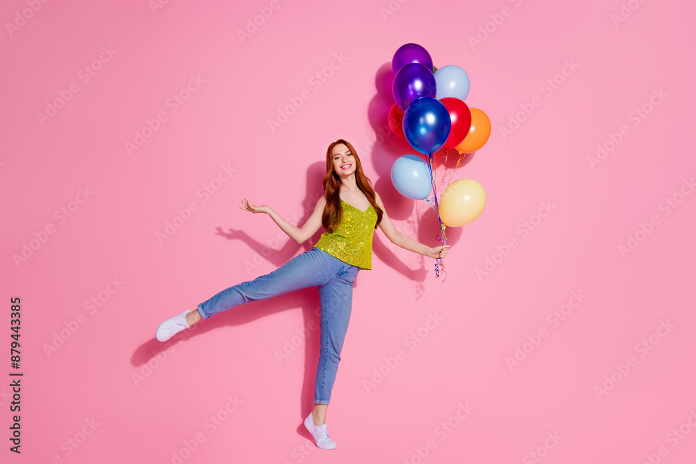 Full size photo of pretty young woman dance balloons wear shiny top isolated on pink color background Full size photo of pretty young woman dance balloons wear shiny top isolated on pink color background