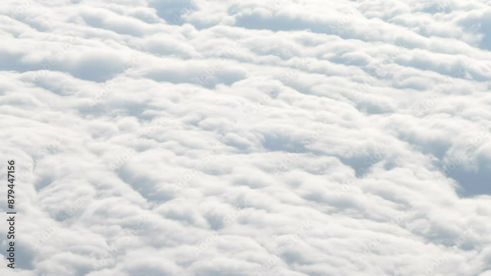 4K Stunning Airplane flight. Flying above the clouds. View from the window of the plane. Traveling by air. Travel, Tourism and Adventure concept 4K Stunning Airplane flight. Flying above the clouds. View from the window of the plane. Traveling by air. Travel, Tourism and Adventure concept