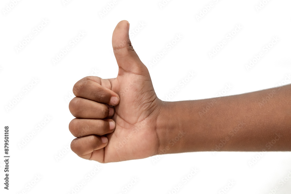 A child's hand is raising a thumb isolated on a white background A child's hand is raising a thumb isolated on a white background
