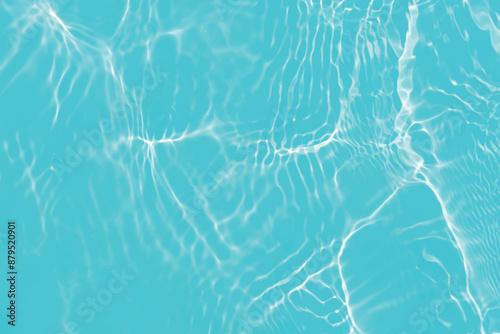 Blue water with ripples on the surface. Defocus blurred transparent blue colored clear calm water surface texture with splashes and bubbles. Water waves with shining pattern texture background.
