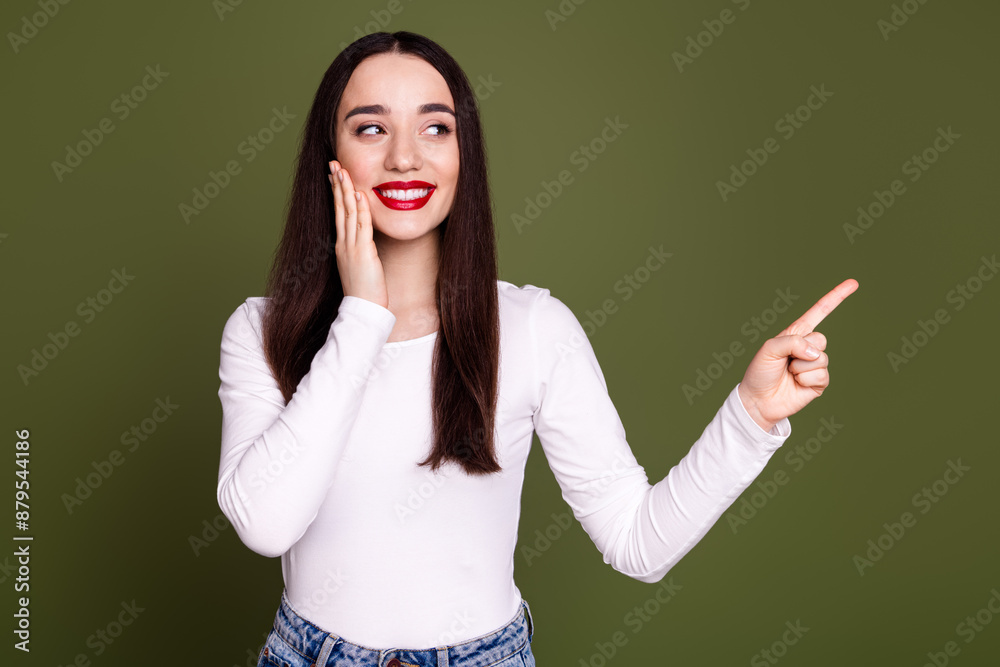 Photo portrait of lovely young lady point look empty space dressed stylish white garment isolated on khaki color background Photo portrait of lovely young lady point look empty space dressed stylish white garment isolated on khaki color background