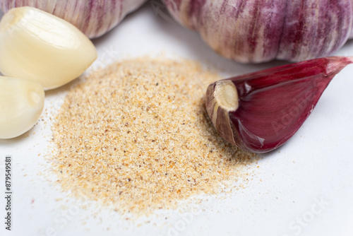 Canvas-taulu Ground dried garlic powder, natural spice, white background.