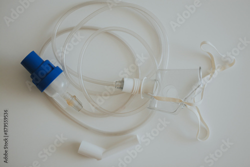Inhalation apparatus consisting of a mask and tubes on a white background photo
