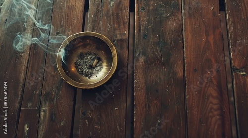 Metal ashtray on brown wooden table aerial view smoking in public areas flat lay