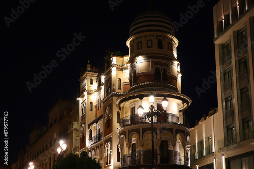 Obraz na płótnie Vintage historical house in downtown in night time in Seville, Spain w salonie