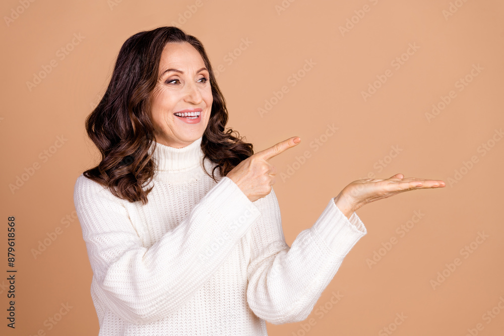 Photo of pretty lovely woman wear white stylish clothes introduce empty space isolated on beige color background Photo of pretty lovely woman wear white stylish clothes introduce empty space isolated on beige color background