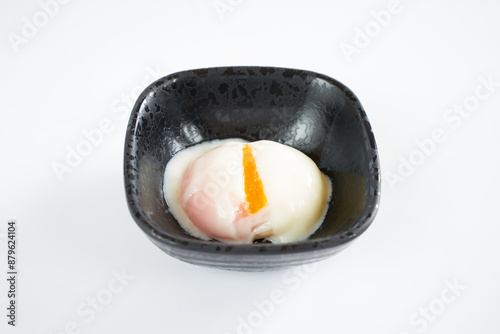 Onsen tamago (Unlike with soft boiled egg, its yolk is hard while its white is soft)