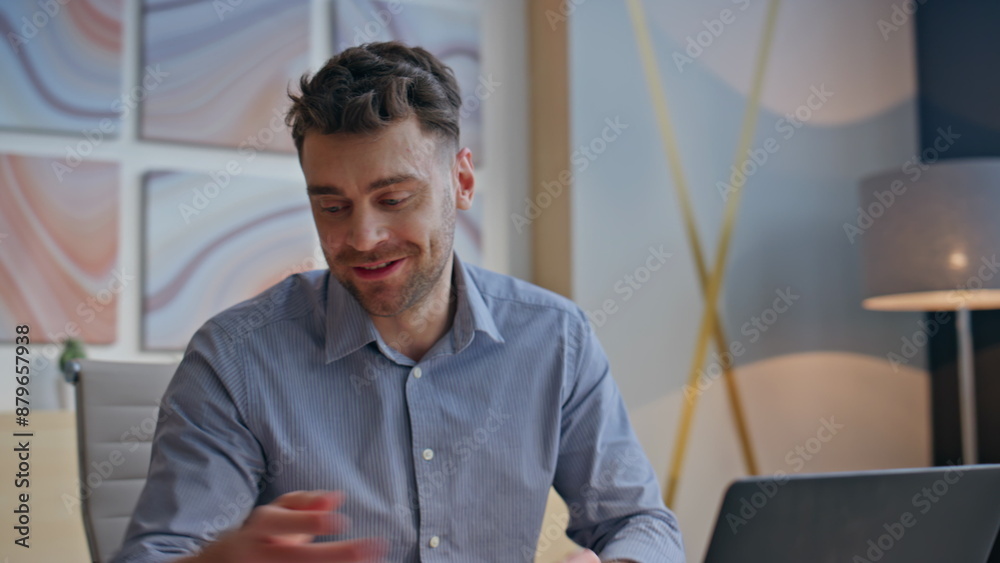 Overjoyed architect laughing virtual conference in office closeup. Man talking Overjoyed architect laughing virtual conference in office closeup. Man talking