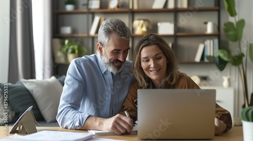 Wallpaper Mural Happy mature couple calculating money expenses savings using laptop at home Middle aged man and woman checking receipts for tax refund paying bills online sitting at table in living ro : Generative AI Torontodigital.ca