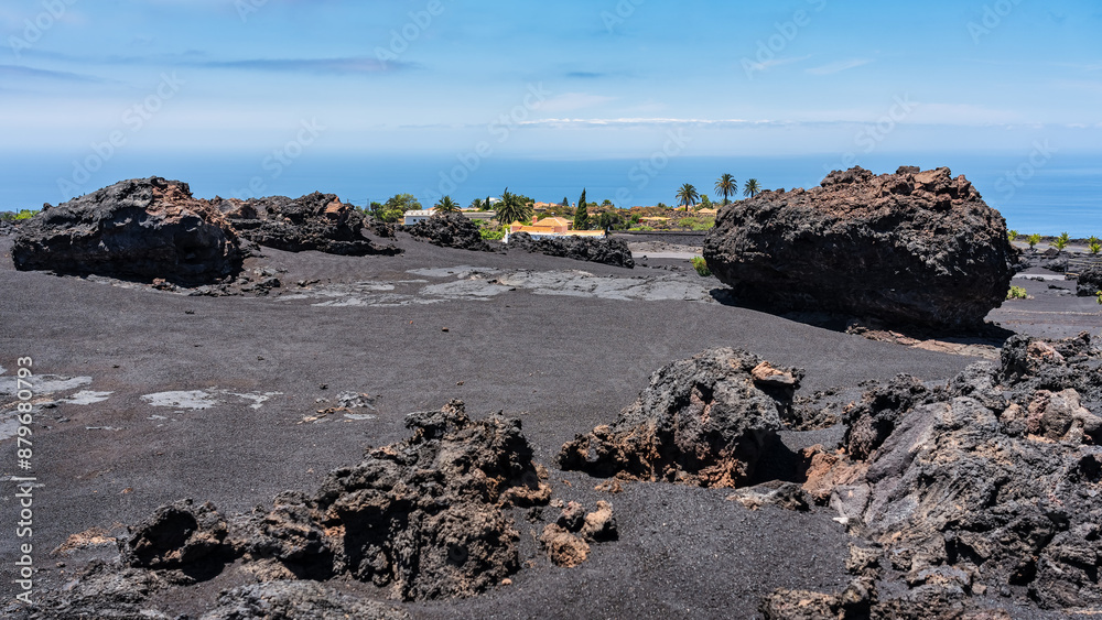 Volcanic landscape with black area and ash formed on the island of La Palma, next to the sea, Canary Islands. Volcanic landscape with black area and ash formed on the island of La Palma, next to the sea, Canary Islands.