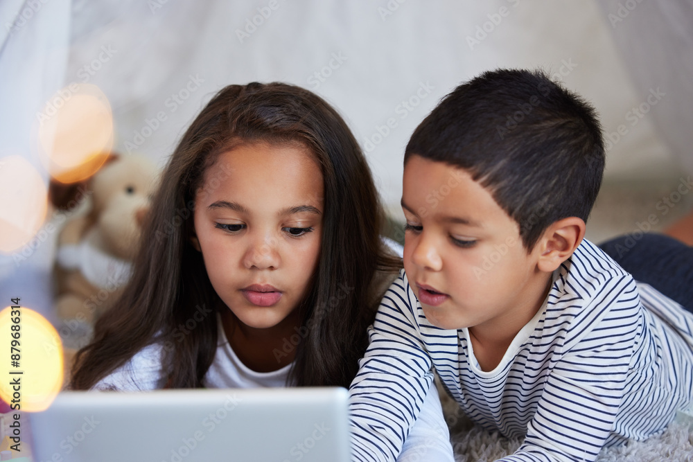 Home, siblings and digital tablet for connection, education and e learning together for bonding on carpet. Children, girl and boy with technology for streaming cartoon, online game and video in house