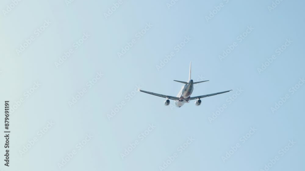 Jet airplane takes off, bottom view. Airplane in the sky, landing gear retracting Jet airplane takes off, bottom view. Airplane in the sky, landing gear retracting
