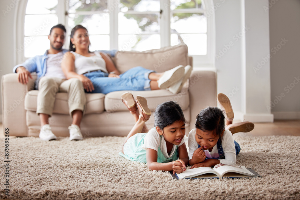 Siblings, relax and kids reading book in home for learning, bonding and knowledge together in family. Education, parents and girls on carpet storytelling for fairytale, fantasy or child development Siblings, relax and kids reading book in home for learning, bonding and knowledge together in family. Education, parents and girls on carpet storytelling for fairytale, fantasy or child development