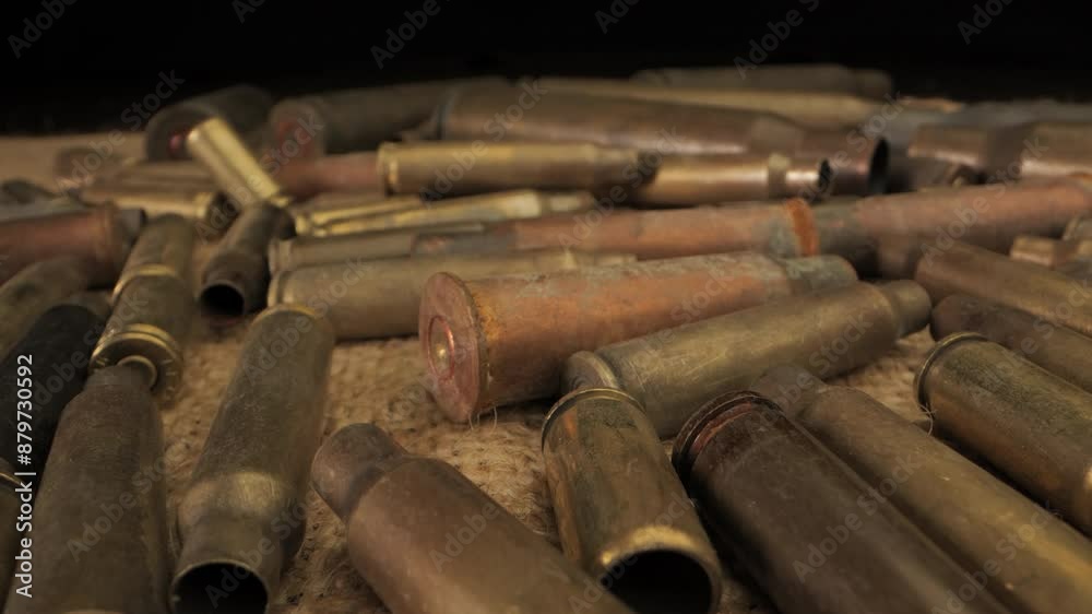 Close Up View of Spent Brass Casings on a Burlap Surface Close Up View of Spent Brass Casings on a Burlap Surface