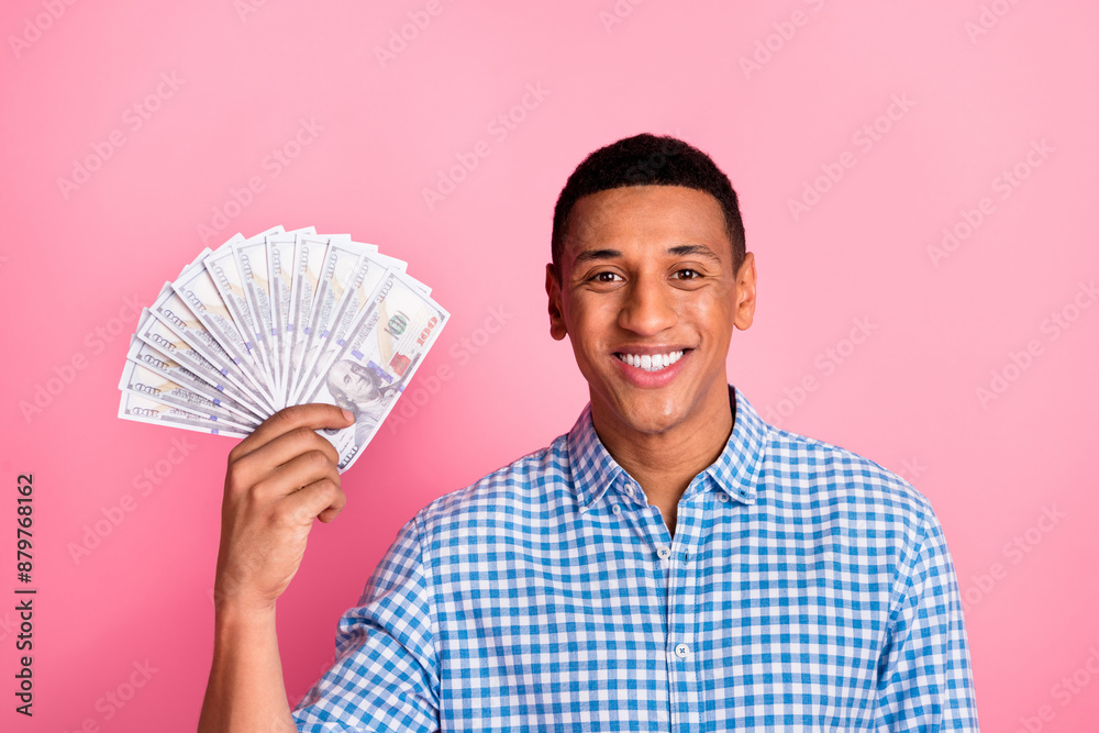 Photo of handsome confident guy wear plaid shirt holding cash fan emtpy space isolated pink color background Photo of handsome confident guy wear plaid shirt holding cash fan emtpy space isolated pink color background