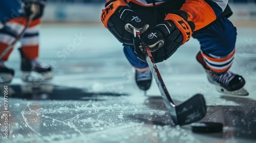 Captivating scene of hockey players engaged in a match, showcasing their skillful play and coordination on the ice while competing intensely for the puck. photo