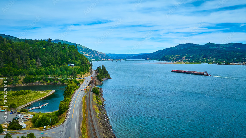 Naklejka premium Aerial View of Columbia Gorge River with Barge and Highway
