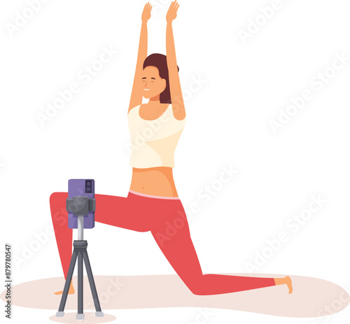 Young woman practicing yoga at home, recording her session with a smartphone on a tripod, to share online