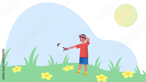 Boy shoots a slingshot in the meadow