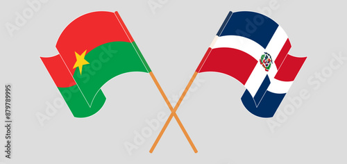 Crossed and waving flags of Burkina Faso and Dominican Republic