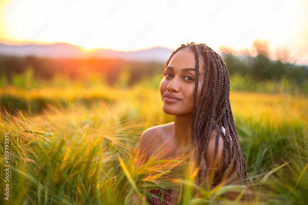 happy young black woman in a red dress on the wheat field in sunset light. health and beauty concept happy young black woman in a red dress on the wheat field in sunset light. health and beauty concept