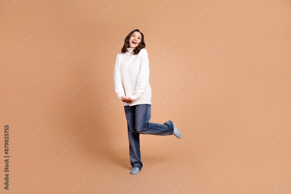 Photo of cheerful funny charming senior woman wear trendy clothes isolated on beige color background Photo of cheerful funny charming senior woman wear trendy clothes isolated on beige color background
