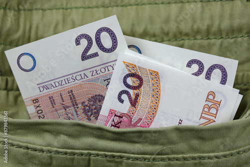 Paper currency, Polish zlotys sticking out of a jacket pocket, PLN