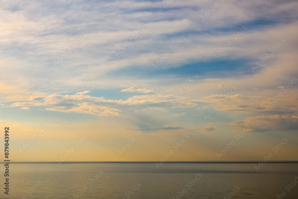The horizon over the sea with the sky changing to the colours of the approaching sunset, Ustronie Morskie, West Pomerania, Poland The horizon over the sea with the sky changing to the colours of the approaching sunset, Ustronie Morskie, West Pomerania, Poland
