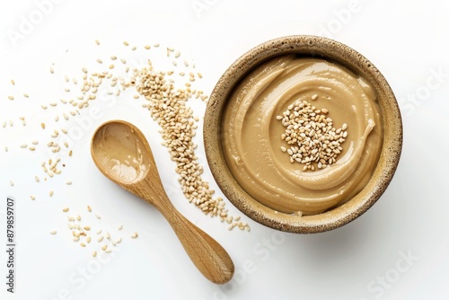 Top view of isolated tahini spread made from sesame butter on white background photo