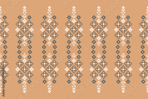 Traditional ethnic motifs ikat geometric fabric pattern cross stitch.Ikat embroidery Ethnic oriental Pixel brown cream label background. Abstract,vector,illustration. Texture,decoration,wallpaper.