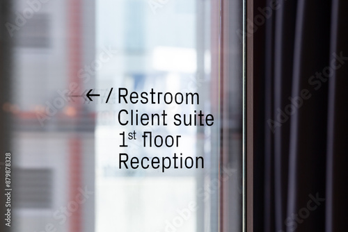 Modern Office Vinyl Signage on Reflective Glass
