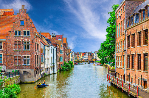 Row of old buildings houses on bank of Lys Leie river in Patershol quarter district in Ghent historical city centre, Gent old town, East Flanders province, Flemish Region, Belgium photo